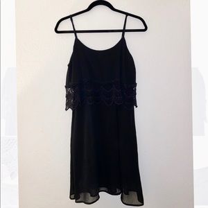 Layered black dress with lace details